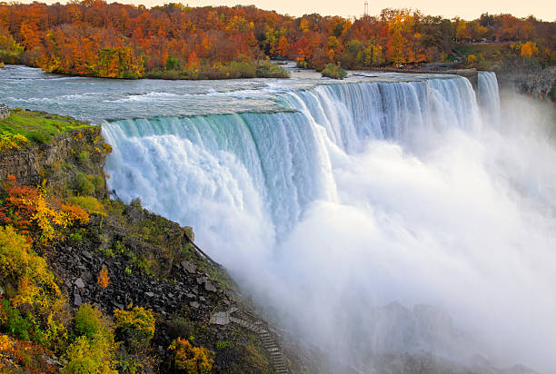 Niagara Falls in Fall Colors Niagara Falls in fall colors, viewed from New York side niagara falls stock pictures, royalty-free photos & images
