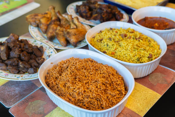 Nigerian Jollof and Fried Vegetable Rice ready to eat stock photo