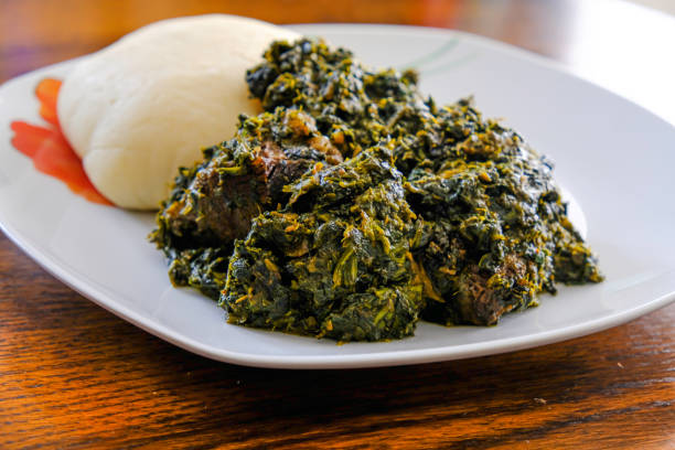 Nigerian Pounded yam served with Afang Soup stock photo