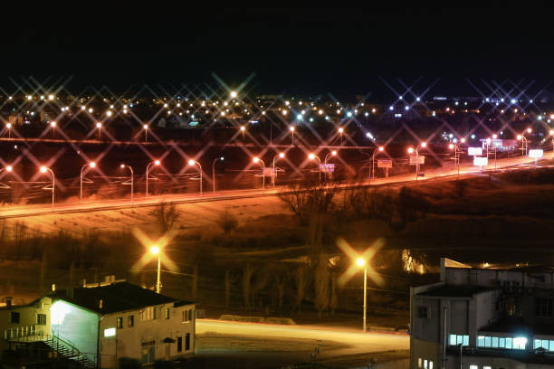 night, city lights, illuminated road stock photo