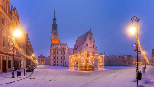 Night Old Town of Poznan, Poland Panorama of Poznan Town Hall and Christmas tree at Old Market Square in Old Town in the snowy night, Poznan, Poland poznan stock pictures, royalty-free photos & images