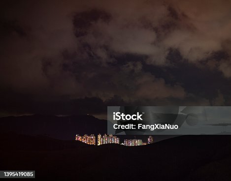 istock Night scene of apartments and real estate in Hong Kong from Shenzhen, China 1395419085