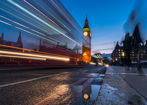 Night shot of The Big Ben and House of Parliament with car light trails, London UK