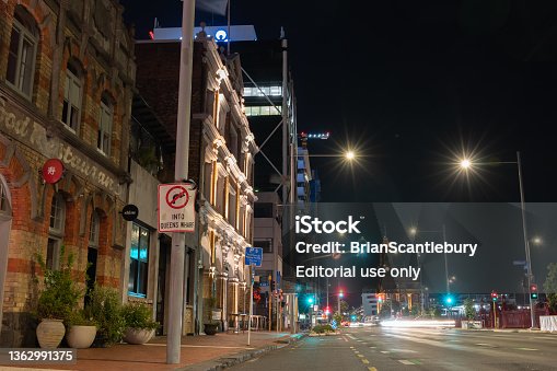 istock Night time on Quay Street with little activity street lights, and buildings. 1362991375