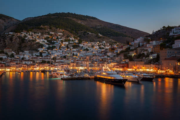 Night view of Hydra's harbor, Argosaronikos Greece stock photo