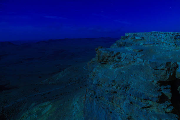 Night view of Makhtesh (crater) Ramon, in the Negev Desert stock photo