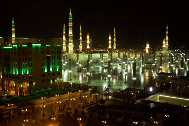 Night view of the beautiful Al-Masjid an-Nabawī Mosque at the center of the Holy City of Medinah stock photo