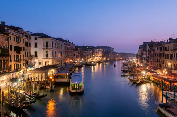 Night view of the Rialto bridge at Venice stock photo