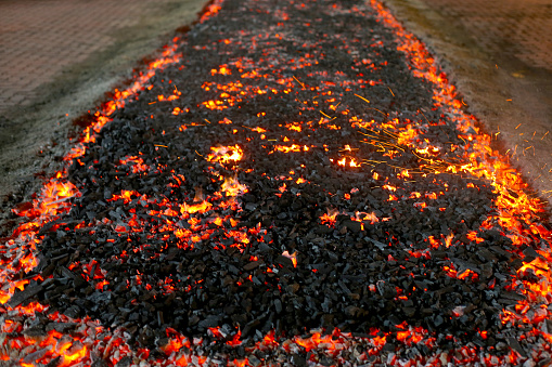 October 13th 2021, Negeri Sembilan MALAYSIA - Chinese celebrates Nine Emperor Gods Festival in Nine Emperor Gods Temple in Kuala Pilah, Negeri Sembilan. It is an one of the biggest annual event with nine-day Taoist celebration beginning on the eve of the ninth lunar month of the Chinese calendar. Burning charcoal is ready for devotees to walk barefoot, in which they must complete 9-day pure vegetarian prior to the ceremony for blessing.