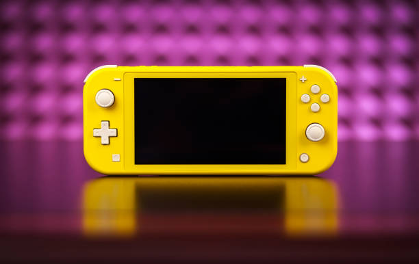 Nintendo Switch Lite is Nintendo's latest entry into handheld gaming. Priced at $199.99, the Switch Lite is available in yellow color MOSCOW, RUSSIA - October 08, 2019: Nintendo Switch Lite is Nintendo's latest entry into handheld gaming. Priced at $199.99, the Switch Lite is available in yellow color switch stock pictures, royalty-free photos & images