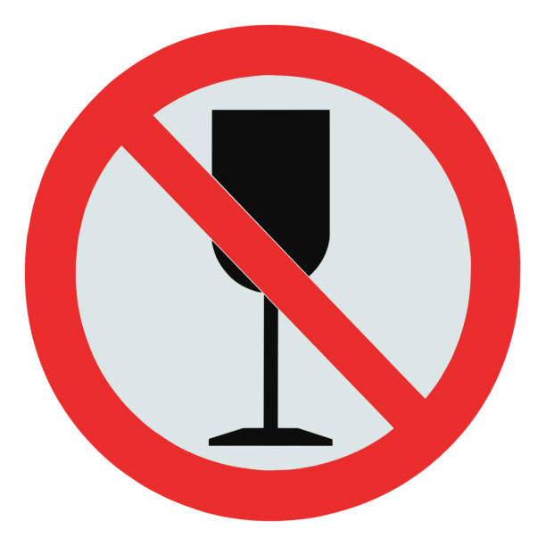 No alcohol sign, isolated drink prohibition zone crossed goblet signage, drinking not permitted concept, large detailed macro closeup, red pictogram frame stock photo