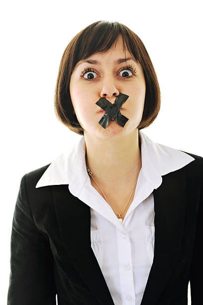 no speech business woman isolated on white with black tape on mouth representing no speech and media censure human mouth gag adhesive tape women stock pictures, royalty-free photos & images