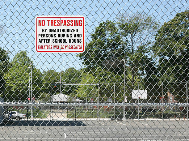 No Trespassing Sign On Fence stock photo