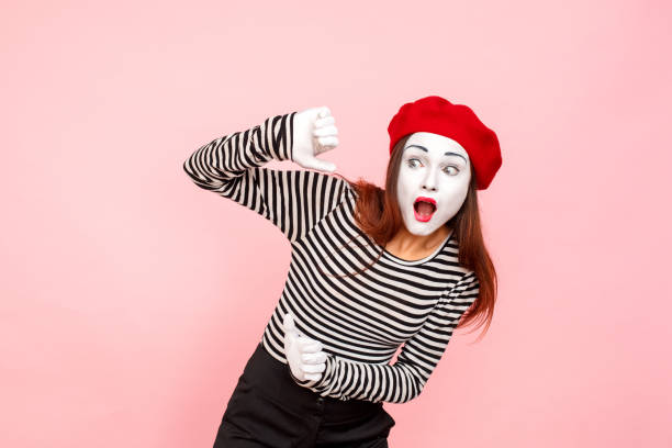 No way! Shocked woman with surprised face look away No way! Shocked woman with surprised face look away. Clown, artist , mime. Studio shot, pink background charades stock pictures, royalty-free photos & images