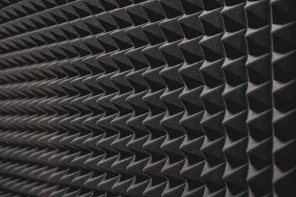 Nobody will hear you. Close up view of a grey soundproof coverage on the wall in music studio. Nobody will hear you. Close up view of a grey soundproof coverage on the wall in music studio. Musical instruments. Live music soundproof stock pictures, royalty-free photos & images