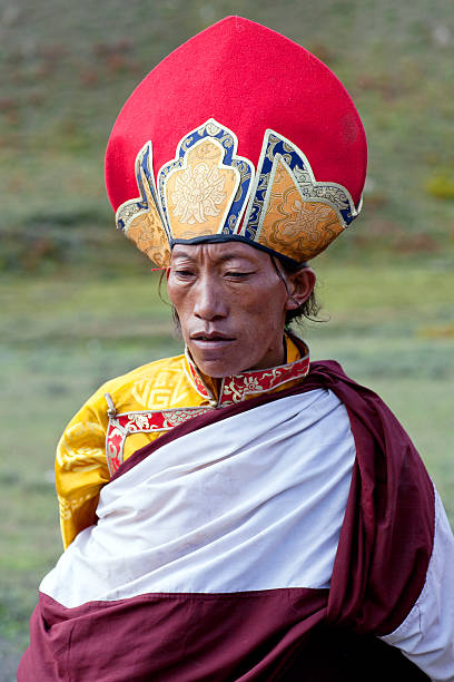Nomadic people in Dolpo, Nepal Dolpo, Nepal - September 11, 2011: Buddhist monk in national clothesl waiting for Puja ceremony during Full Moon festival. tibetan ethnicity stock pictures, royalty-free photos & images