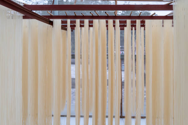 Noodles hung in the room, traditional Chinese food stock photo