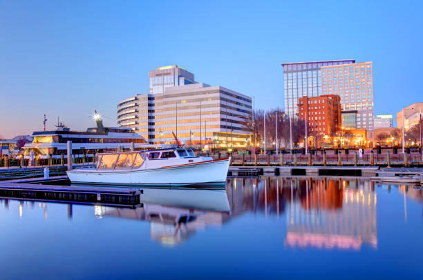 Norfolk, Virginia Waterfront Norfolk is an independent city in the Commonwealth of Virginia in the United States.  It is one of the seven major cities that compose the Hampton Roads metropolitan area chesapeake bay stock pictures, royalty-free photos & images