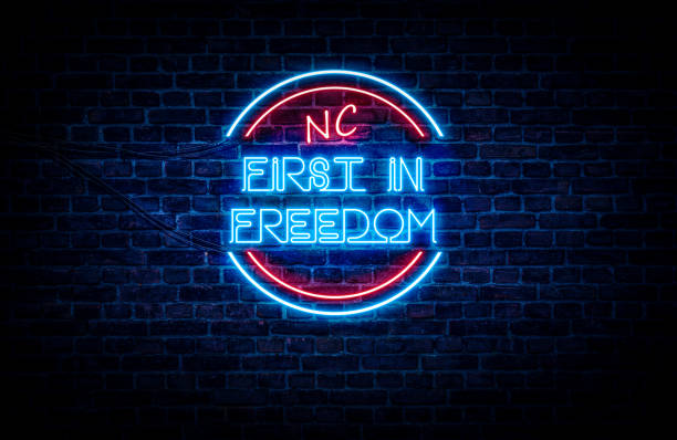 North Carolina NC First in Freedom A blue and red neon sign showing the slogan of the state: North Carolina 
(Slogans for all 50 states are also available in my portfolio) north carolina us state photos stock pictures, royalty-free photos & images