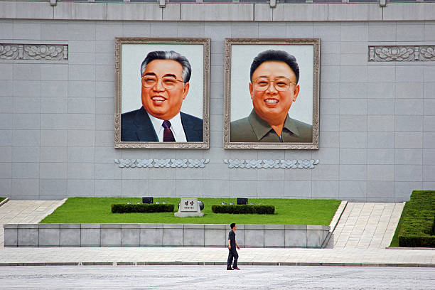 North Korea DPRK: Walking across Kim Il Sung Square stock photo