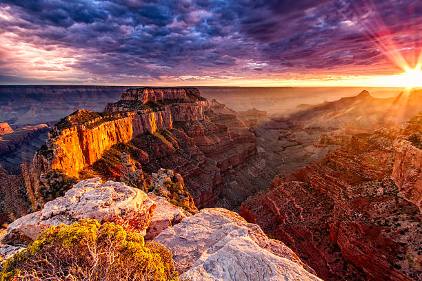 North Rim Grand Canyon Cape Royal Sunset from the over look on Cape Royal. Wild fires caused the spectacular colors in the sky and enhanced the orange glow on the sandstone walls. grand canyon stock pictures, royalty-free photos & images