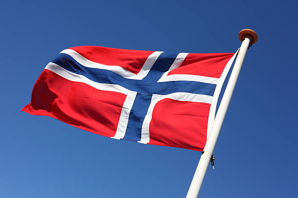 Norwegian Flag blowing in the wind stock photo