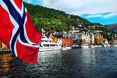 istock Norwegian flag with the port of Bergen 1303213546