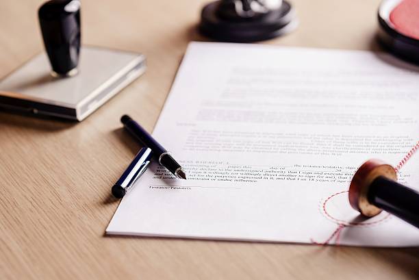 Notary pen lying on testament. Notary pen lying on testament. Notary public working accesories letter document stock pictures, royalty-free photos & images