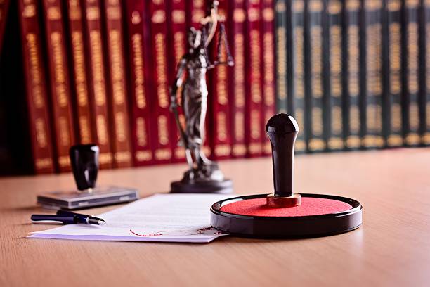 Notary's public working tools. Notary's public working tools. Metal stamper, rubber stamp, pen and statue of Themis bill legislation stock pictures, royalty-free photos & images