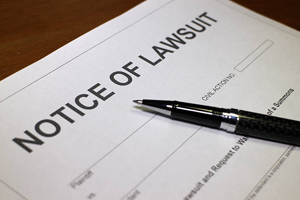 Notice of Lawsuit Someone filling out Notice of Lawsuit Form. lawsuit stock pictures, royalty-free photos & images
