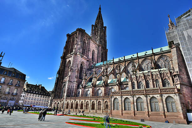 Notre Dame of Strasbourg Strasbourg, France - 05 April 2015: The tremendous Cathedral Notre Dame from Strasbourg, on the side, which is the 6th tallest church in the world. notre dame de strasbourg stock pictures, royalty-free photos & images