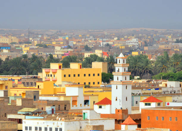 Nouakchott, Mauritania: skyline - minaret, houses, palm tress and the Atlantic in the distance stock photo