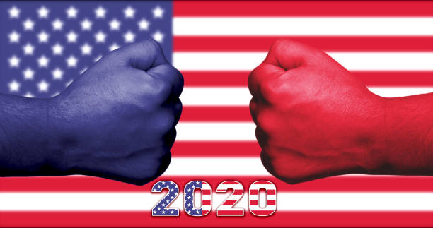 November 2020 American presidential elections concept with blue and red fists facing each other and the USA flag in the background. November 2020 American presidential elections concept with blue and red fists facing each other and the USA flag in the background. voting ballot photos stock pictures, royalty-free photos & images