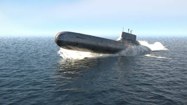 A nuclear-powered military submarine emerges from the depths of the ocean. 3D Rendering A nuclear-powered military submarine emerges from the depths of the ocean. torpedo weapon stock pictures, royalty-free photos & images