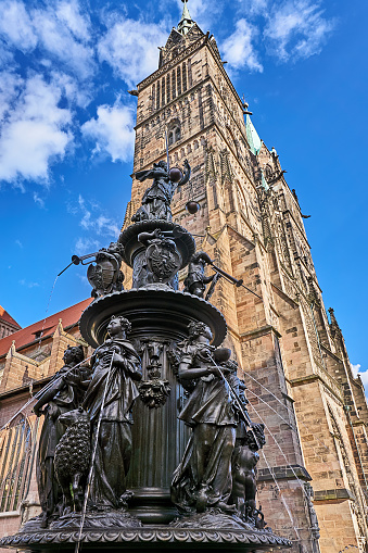 Nuernberg, Germany - May 28, 2022: Fountain of virtue at the Lorenz Church in Nuremberg.