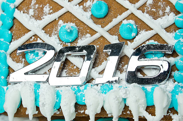 Number 2016 over decorated gingerbread house Number 2016 over decorated gingerbread house close up happy new year card 2016 stock pictures, royalty-free photos & images