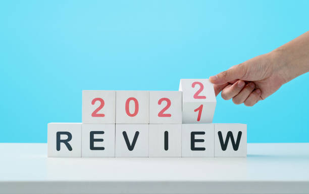 Number 2021 2022 and word review on the table stock photo