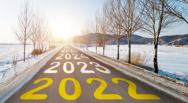 Number of 2022 to 2026 on blurred motion winter road stock photo