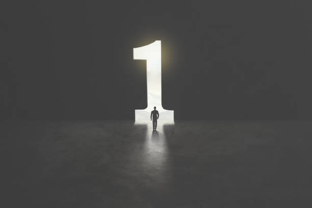 number one shaped as a hole in concrete wall, victory concept serie of images representing a business man in silhouette walking trough different shaped door in concrete wall number 1 stock pictures, royalty-free photos & images