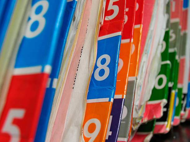 Numbered medical records folders on the shelf. stock photo