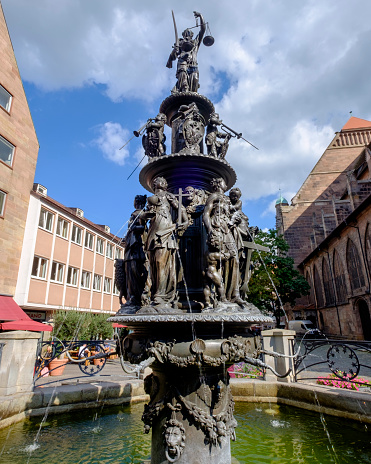 The Tugendbrunnen - Fountain of the Virtues - was created by Benedikt Wurzelbauer in 1589 and is located in Lorenzer Platz in the old town of Nuremberg, the second-largest city of Bavaria.