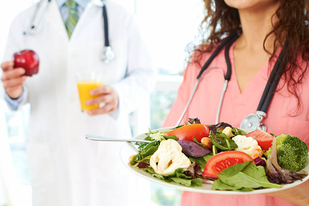 nurse and doctor holding health food stock photo