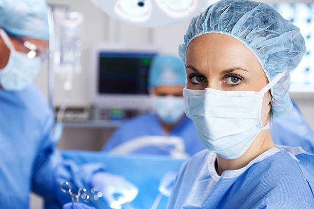 Nurse In Operating Room XXXL.  Close up of nurse in operating room looking at camera. gchutka stock pictures, royalty-free photos & images