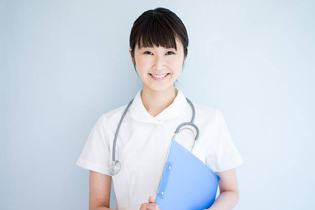 Nurse with a stethoscope and clipboard stock photo