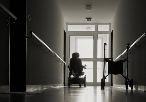nursing home lonely corridor with walker in a nursing home elderly care stock pictures, royalty-free photos & images