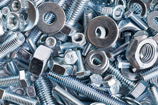 nuts and bolts pile of steel nuts and bolts nail work tool stock pictures, royalty-free photos & images