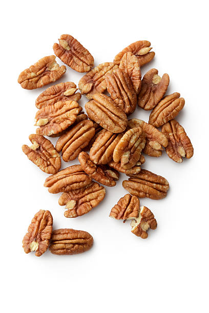 Nuts: Pecan Nuts Isolated on White Background More Photos like this here... pecan stock pictures, royalty-free photos & images