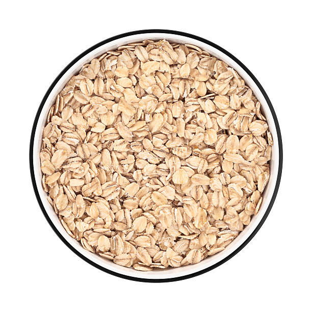 Oat flakes in a bowl from directly above stock photo