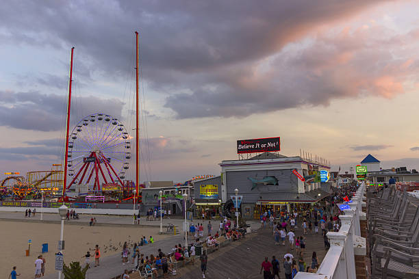 Ocean city, MD boardwalk and pier at sunset 2015 Ocean city, Maryland boardwalk and pier at a beautiful sunset in August 2015 boardwalk stock pictures, royalty-free photos & images