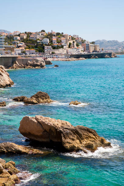 ocean crashing onto Marseille waterfront stock photo
